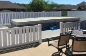 vinyl fencing surrounding outdoor above ground pool
