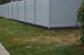pvc vinyl privacy fence surrounding corner residential home