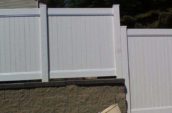 jasper pvc vinyl privacy fence on stone wall